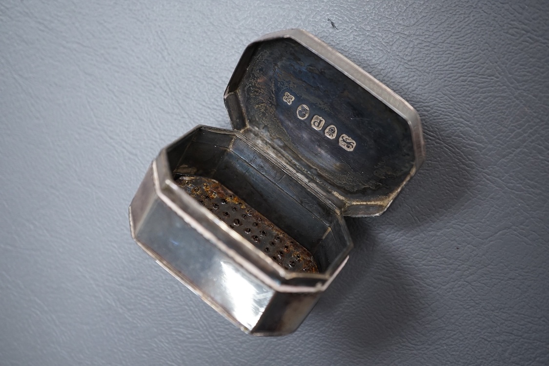 A George III silver octagonal nutmeg grater by Phipps & Robinson, London, 1810, 46mm(a.f.), together with a George III silver pedestal pepperette, by Alice & George Burroughs, London, 1808, 70mm.